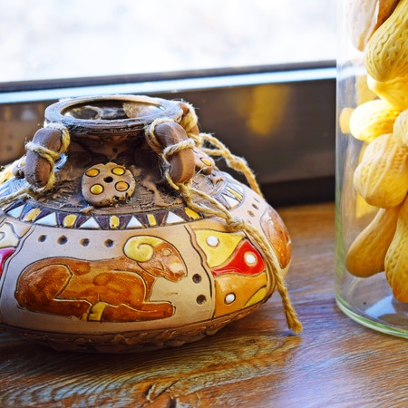 Beautiful clay pot on wooden background.The design of the cafの写真素材