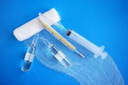 Medical preparation.Syringe on blue background.の写真素材