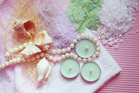 Colorful bath salt on pink background. Healthy skin care.の写真素材