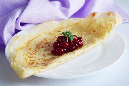 Delicious homemade pancakes with a white background.