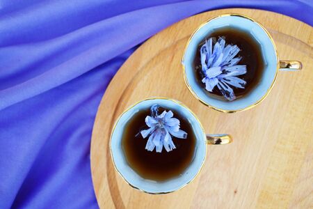A healthy herbal drink. The substitute for coffee is chicory. Diet drink and blue flowers.の写真素材