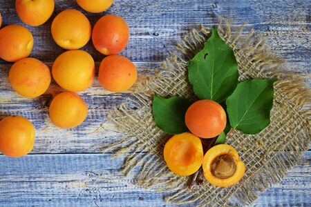 Ripe, sweet apricots on a wooden background.Healthy fruit.の写真素材