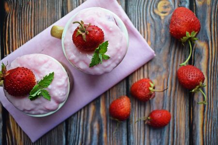 Delicious strawberry pudding in a cup and fresh strawberries. Healthy diet.の写真素材