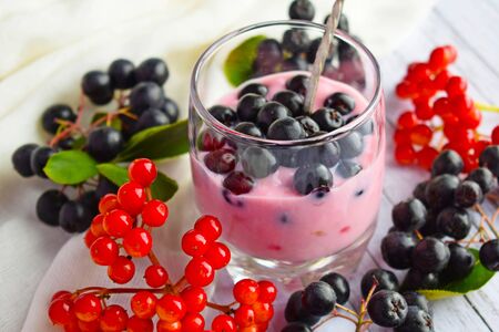 Ripe, fresh berries. Delicious dessert in a glass Cup on the table.の写真素材