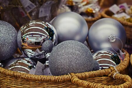 Beautiful Christmas toys in a wicker basket. Merry winter holidays.の写真素材