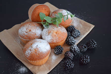 Muffins are delicious pastries. Delicious dessert on the table - homemade muffins. Portioned cupcakes.の写真素材