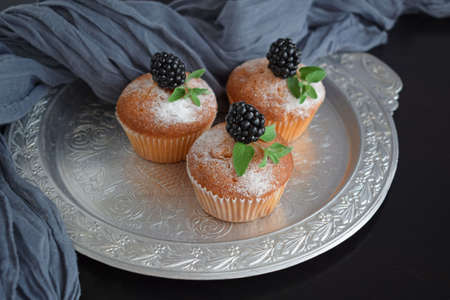 Muffins are delicious pastries. Delicious dessert on the table - homemade muffins. Portioned cupcakes.の写真素材