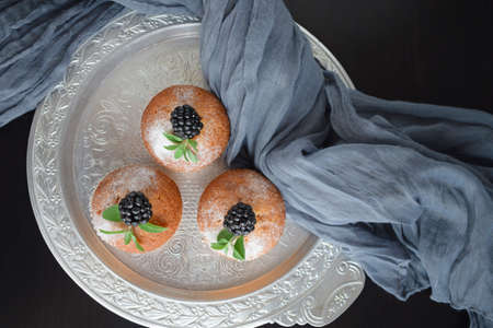 Muffins are delicious pastries. Delicious dessert on the table - homemade muffins. Portioned cupcakes.の写真素材