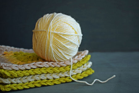 Wool yarn for knitting on a gray background.A hobby.
