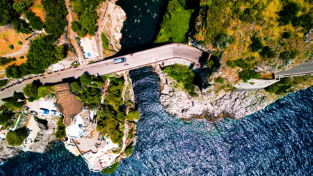 Aerial view of the sea and the roadの写真素材