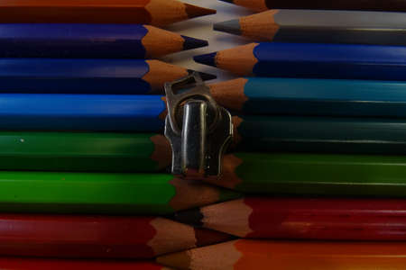 Colored pencils are in a row