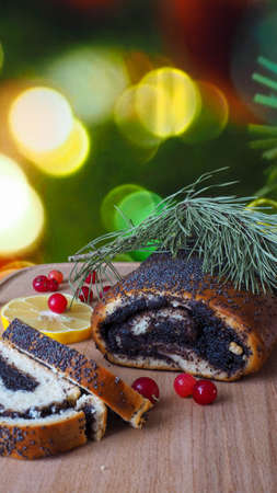 Festive Christmas dessert roll with poppy seedsの写真素材