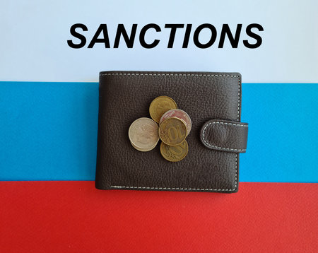 Flag of Russia in colors of Russian flag and an empty wallet with coins. Sanctions economic financial political with war Ukraine and Russiaの写真素材