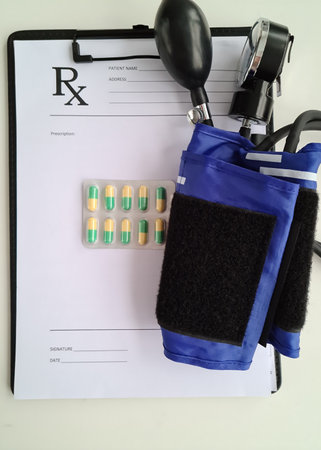 Medical prescription pills and tonometer on table. Pain in heart and high and low blood pressure...