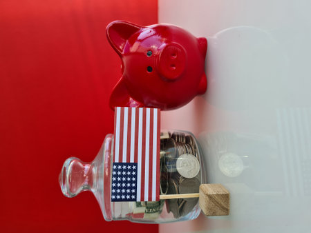 American flag piggy bank with coin and piggy bank. American financial system and money saving conceptの写真素材
