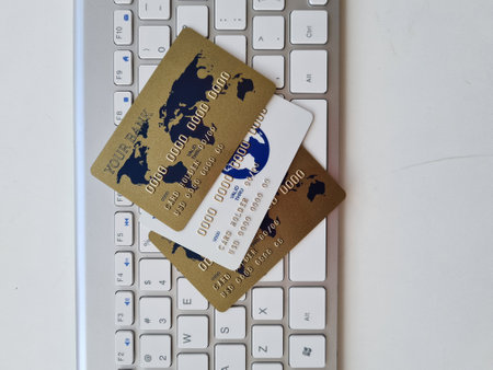 Computer keyboard and credit bank cards. Online card issuance and remote financial payments concept