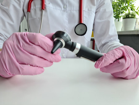 Hearing aid ENT doctor with otoscope. Ear examination conceptの写真素材