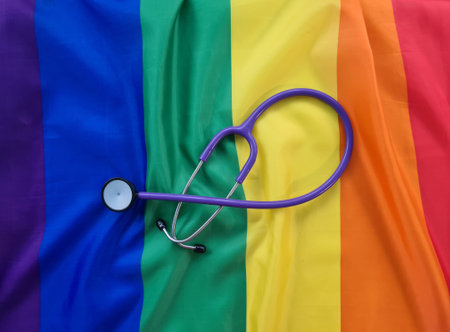 Stethoscope on rainbow LGBT flag. Medicine and the LGBT community conceptの写真素材