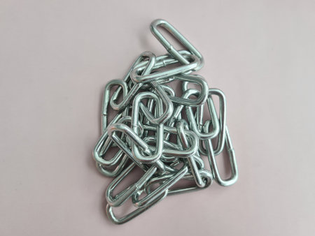 Gray chain stacked in pile, steel metal iron chain concept