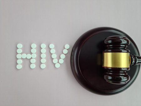 Judicial gavel and text hiv aids and judgment. Symbol of fight against AIDSの写真素材