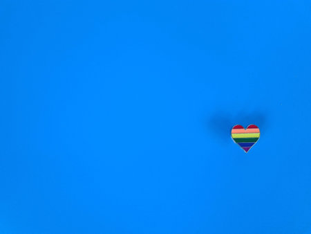 Rainbow ribbons sign symbolize gay and LGBT pride on blue background. Community of lesbian gay bisexual transgender peopleの写真素材