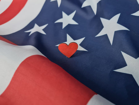 Love for America and heart on the background of USA flag. Patriotism and love and the heart of countryの写真素材