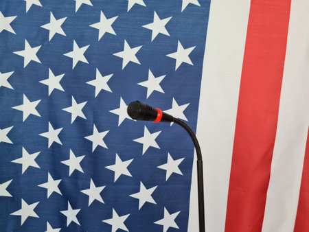 Microphone on stand with US flag on background. Filtered image: cross processedの写真素材