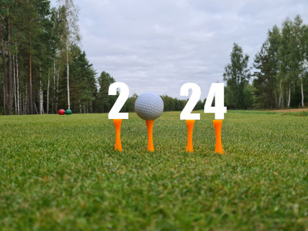 Golf 2024 and New Year number with golf ball on a grassy field. New golf seasonの写真素材