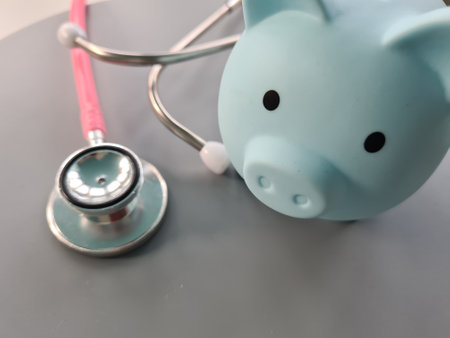 Piggy bank recommending saving money for health insurance promotional fee or charity. Medicine and financeの写真素材