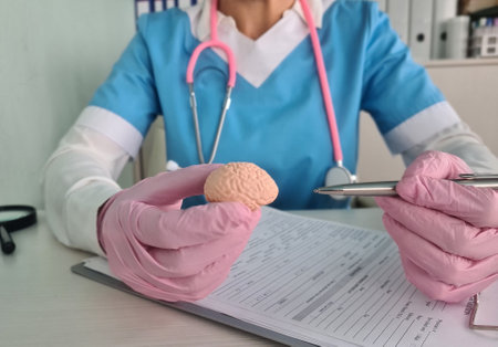 Doctor holding an artificial model of human brain. Dementia treatmentの写真素材