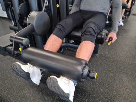 Male muscular legs training. Leg exercises closeupの写真素材