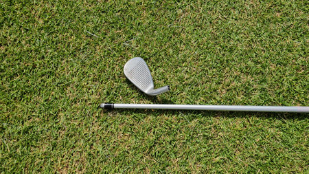 Broken golf club shaft. Broken golf club on the golf course
