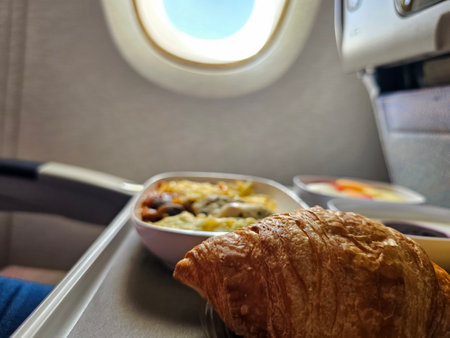 Tray of food on an airplane. Food and air travel concept