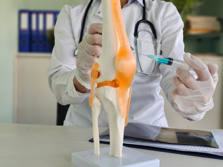 Doctor with help from a syringe injects the patient blood plasmaの写真素材