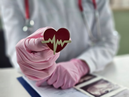 The doctor shows off a heart-shaped brooch. The accessory represents a commitment to medicine and a passion for heart health.の写真素材