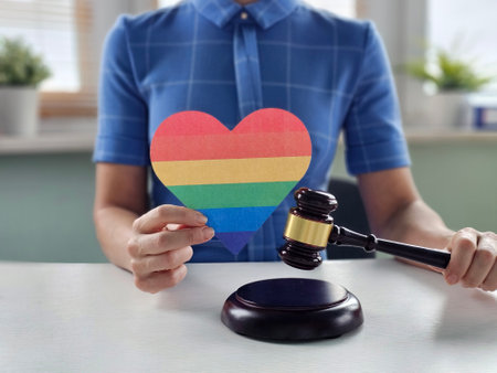 LGBT equality and laws concept. Wooden judge gavel with LGBT flag.の写真素材