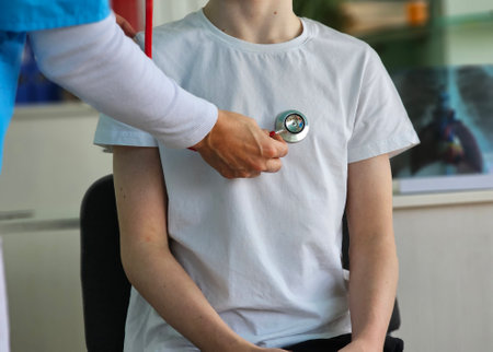 Medical professional conducting a check-up on a patient in a clinical setting