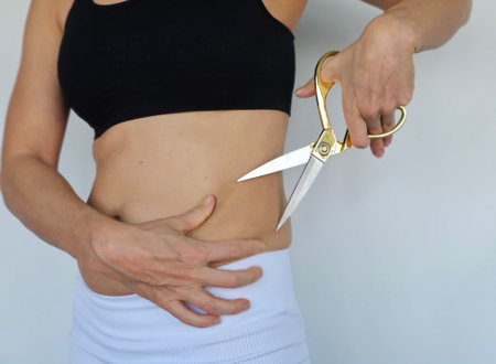 Body part with measuring tape and scissorsの写真素材