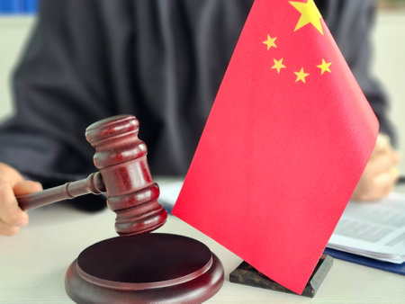 China flag and gavel represent legal proceedings in a courtroom setting, underscoring the importance of justice in the nationの写真素材