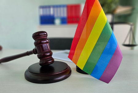Courtroom setting with a rainbow flag and gavel symbolizing LGBTQ rights and justiceの写真素材
