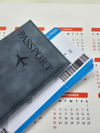 Travel documents and calendar showcasing travel plans for upcoming journeyの写真素材