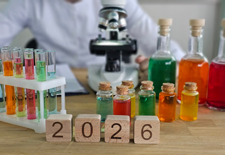 Colorful glass vials and laboratory equipment displayed for scientific exploration in a modern lab settingの写真素材