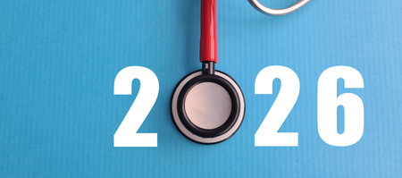 Stethoscope with number 2024 on blue background. Health care and calendar coverの写真素材