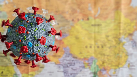 Virus model displayed over a map of Asia, highlighting global health challenges and the importance of awarenessの写真素材