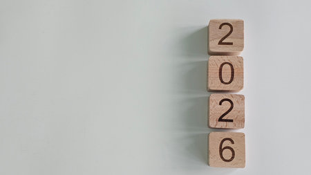 Wooden blocks arranged to display the year 2026 on a neutral background