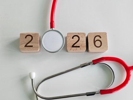 Blocks display the year 2026 alongside a stethoscope symbolizing health and medical progressの写真素材