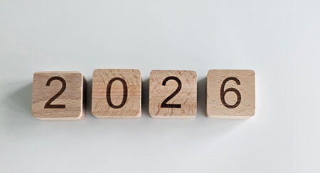 Wooden blocks displaying the year 2026 arranged neatly on a light surfaceの写真素材