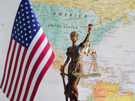 Symbol of justice and freedom with American flag and map in background depicting legal representationの写真素材