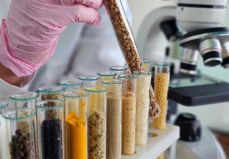Scientist conducting an experiment with various samples in test tubes during a lab session