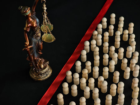 The scales of justice versus society. Crimes against justice. Migrants, refugees, criminals, and the lawの写真素材